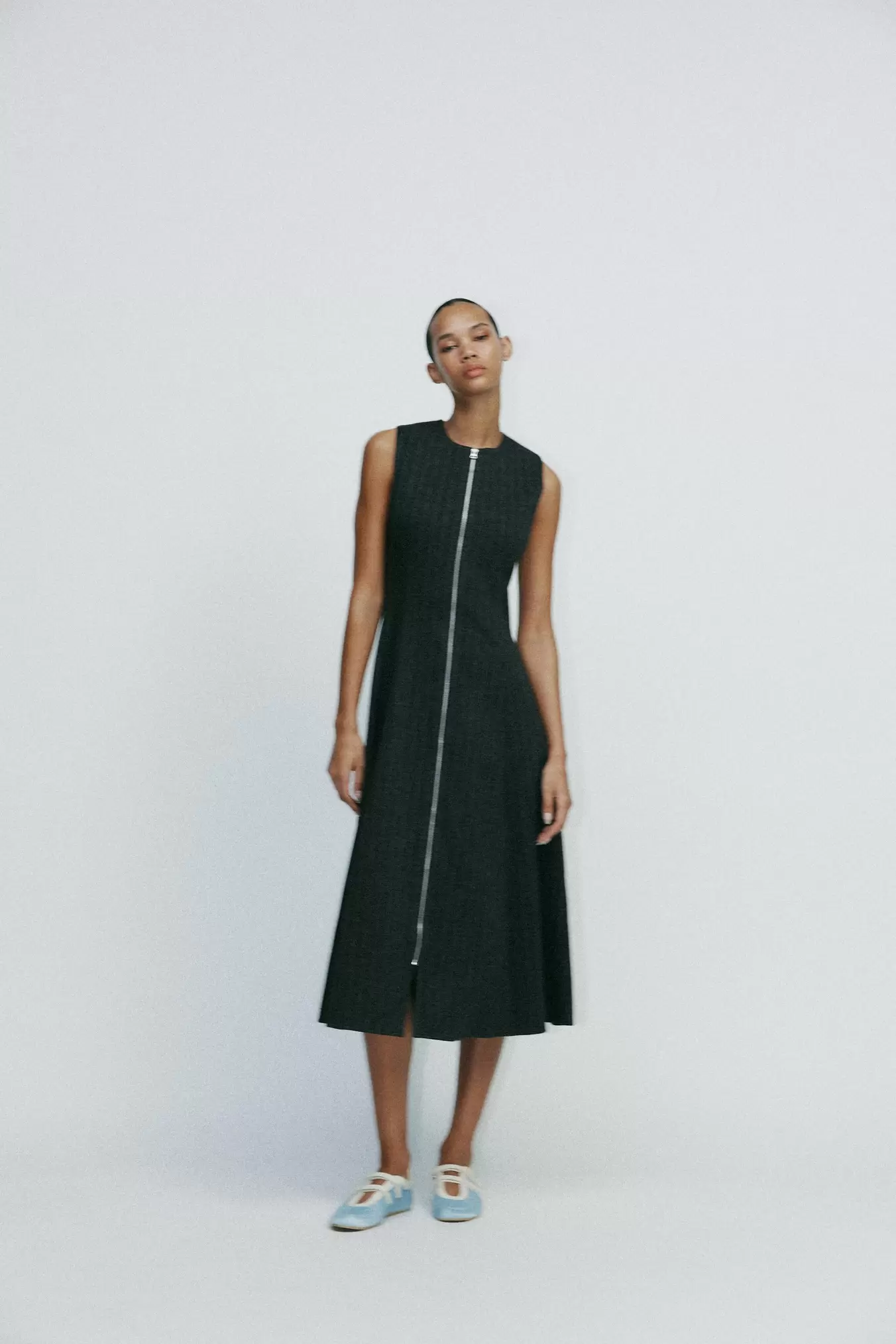 PINSTRIPED MIDI DRESS offers at 299 Dhs in Zara