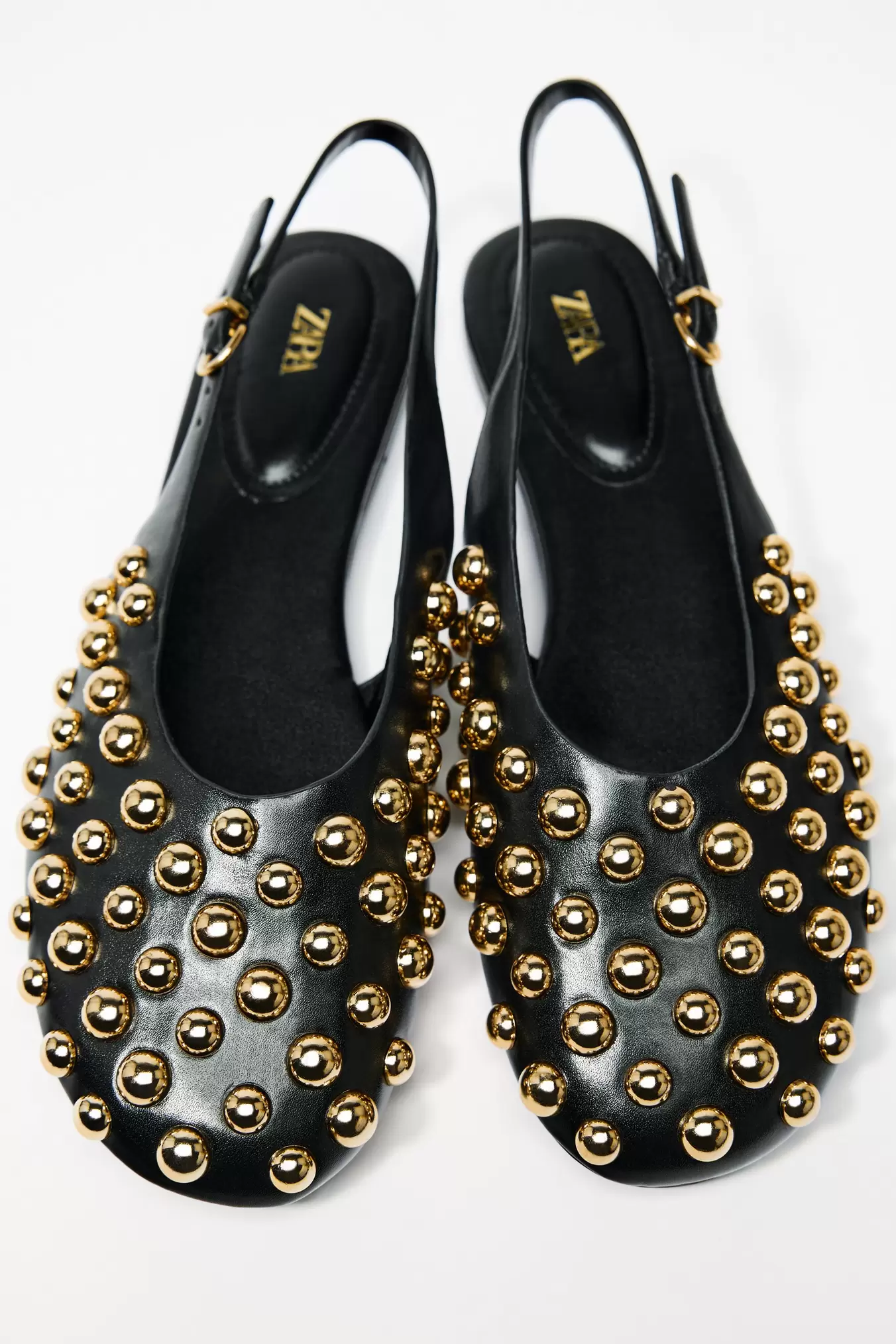 FLAT SLINGBACK SHOES WITH STUDS offers at 269 Dhs in Zara