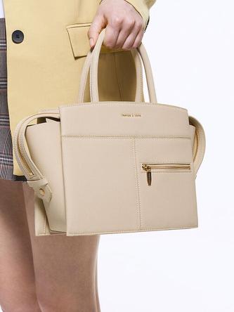 Anwen Trapeze Top Handle Bag               - beige offers at 450 Dhs in Charles & Keith