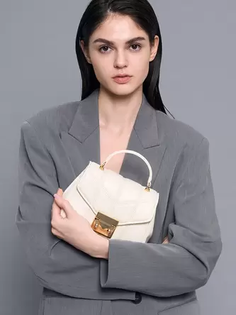 Eudora Chevron Top Handle Bag  - cream offers at 325 Dhs in Charles & Keith