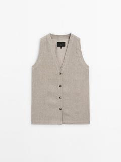 Waffle-knit V-neck vest offers at 499 Dhs in Massimo Dutti