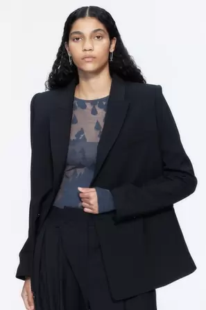 بلوزة مزينة بنقوش Burnout offers at 85 Dhs in H&M